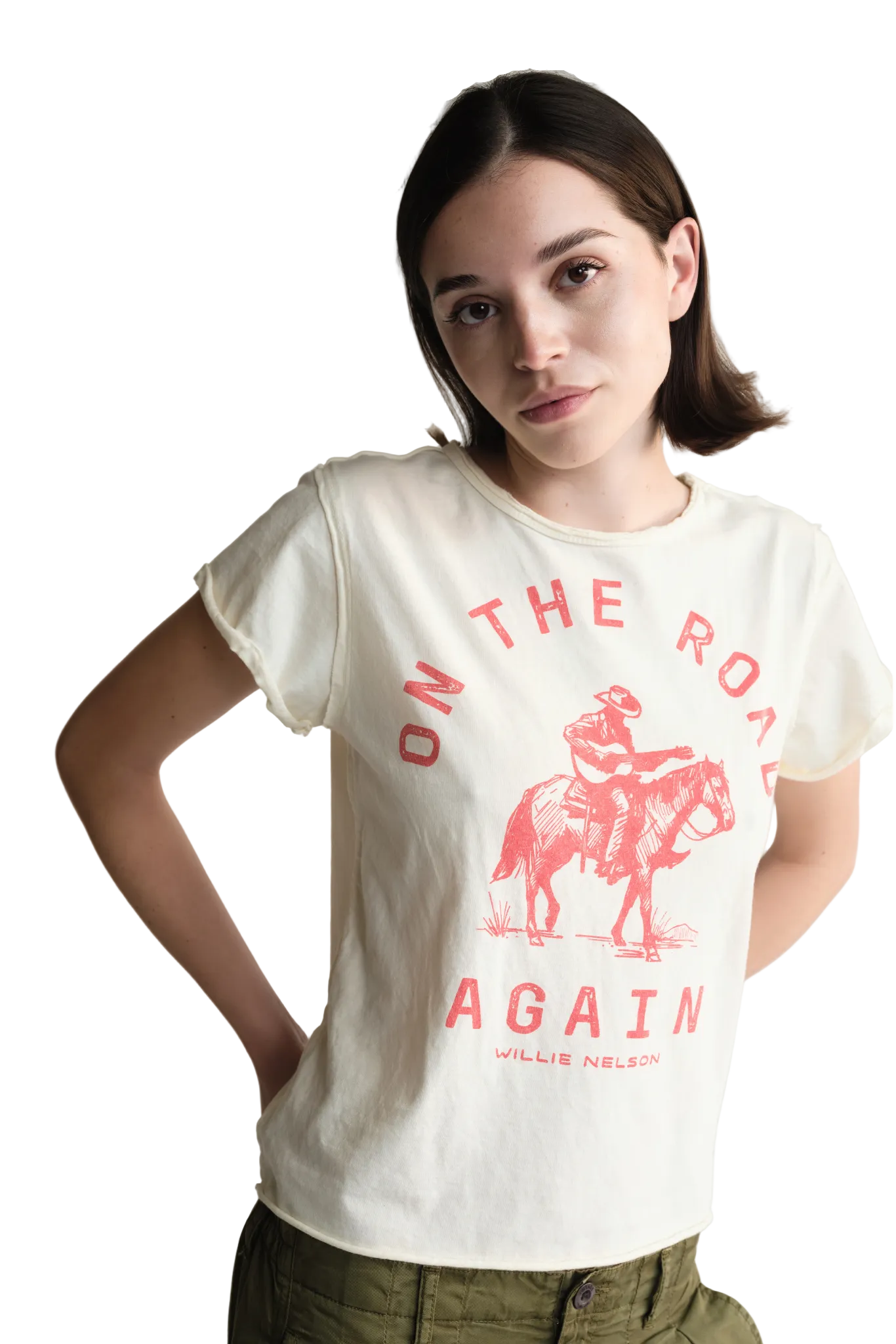 Woman wearing a white t-shirt with red text and graphic, standing against a plain background