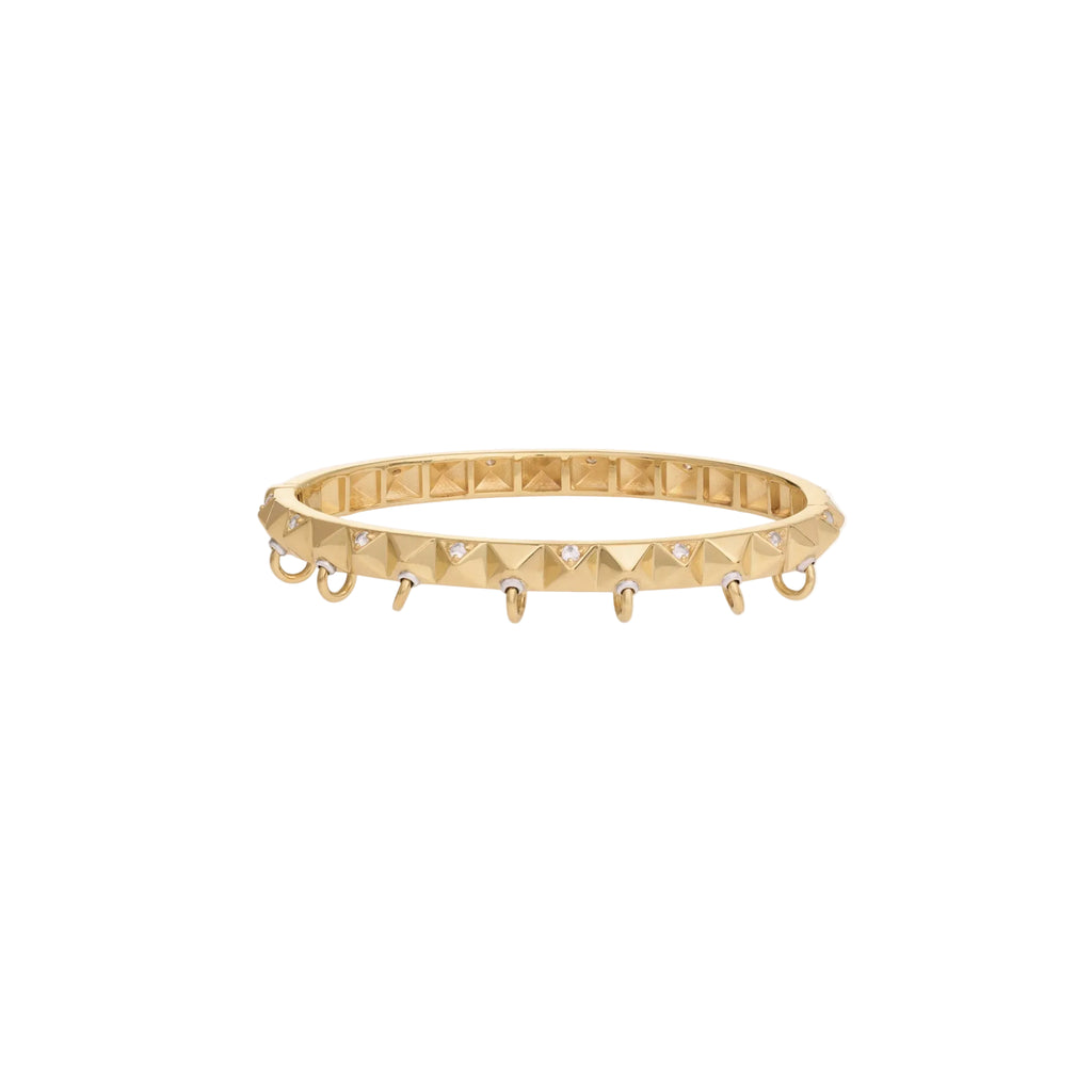 Gold bracelet with pyramid design on a white background
