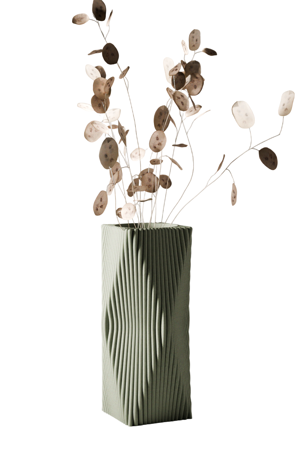 Green textured vase with dried flowers on a light gray background
