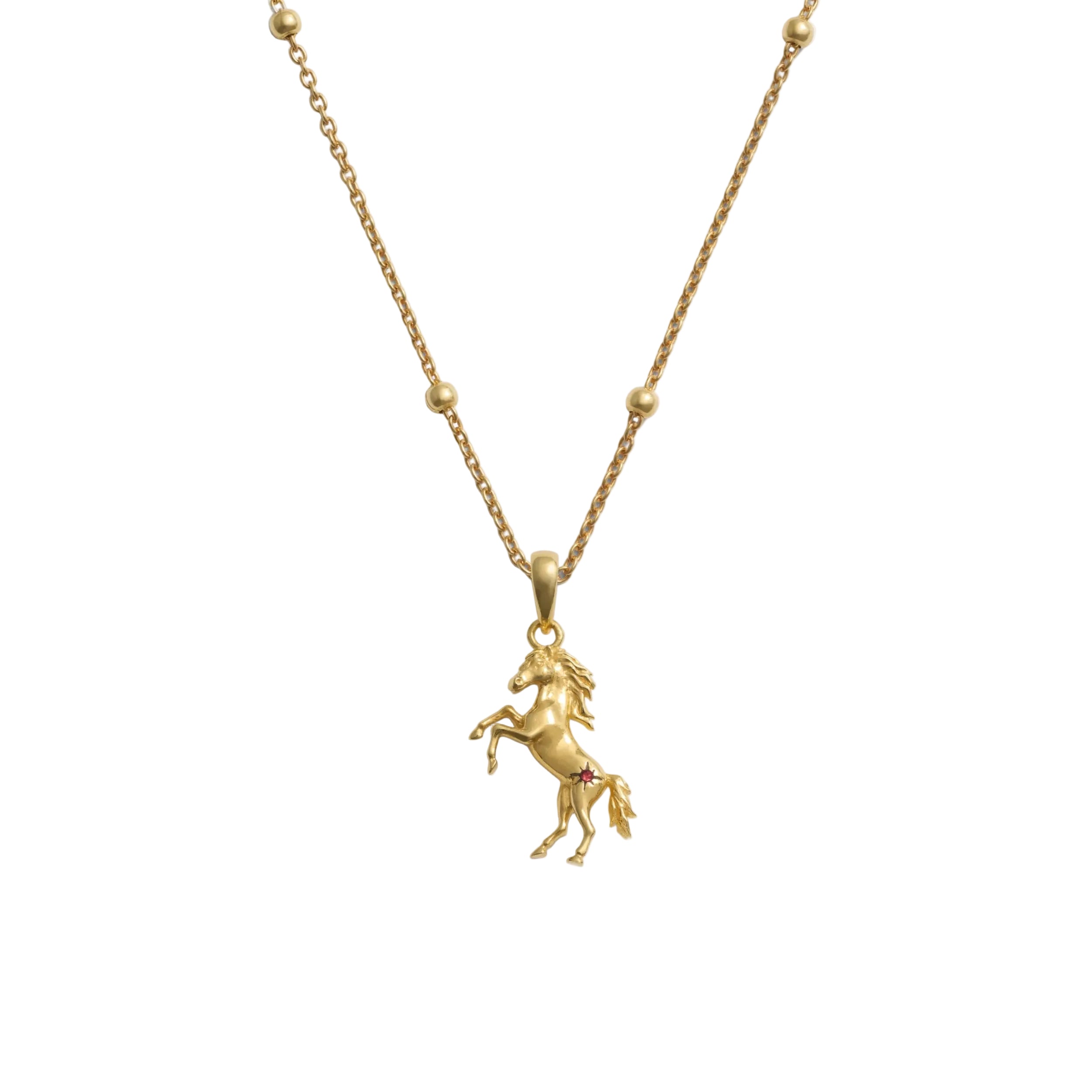 Gold horse pendant necklace on a white background