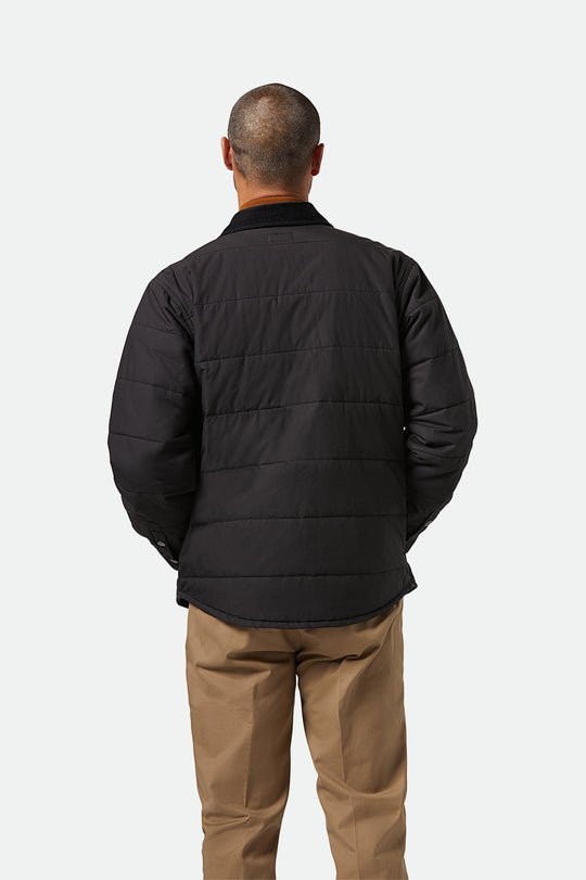 Back view of Brixton Cass Jacket showing curved hem and clean silhouette on model.