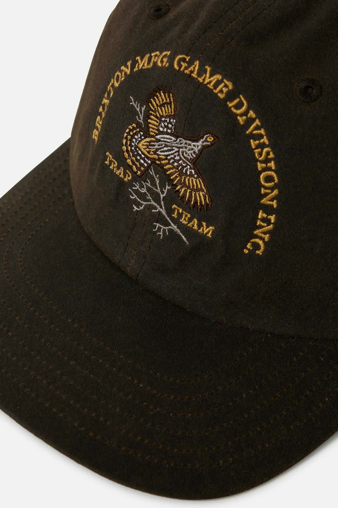 Wild game embroidered design on front panel of Brixton Game Weather Cloth Netplus Hat in moss green.