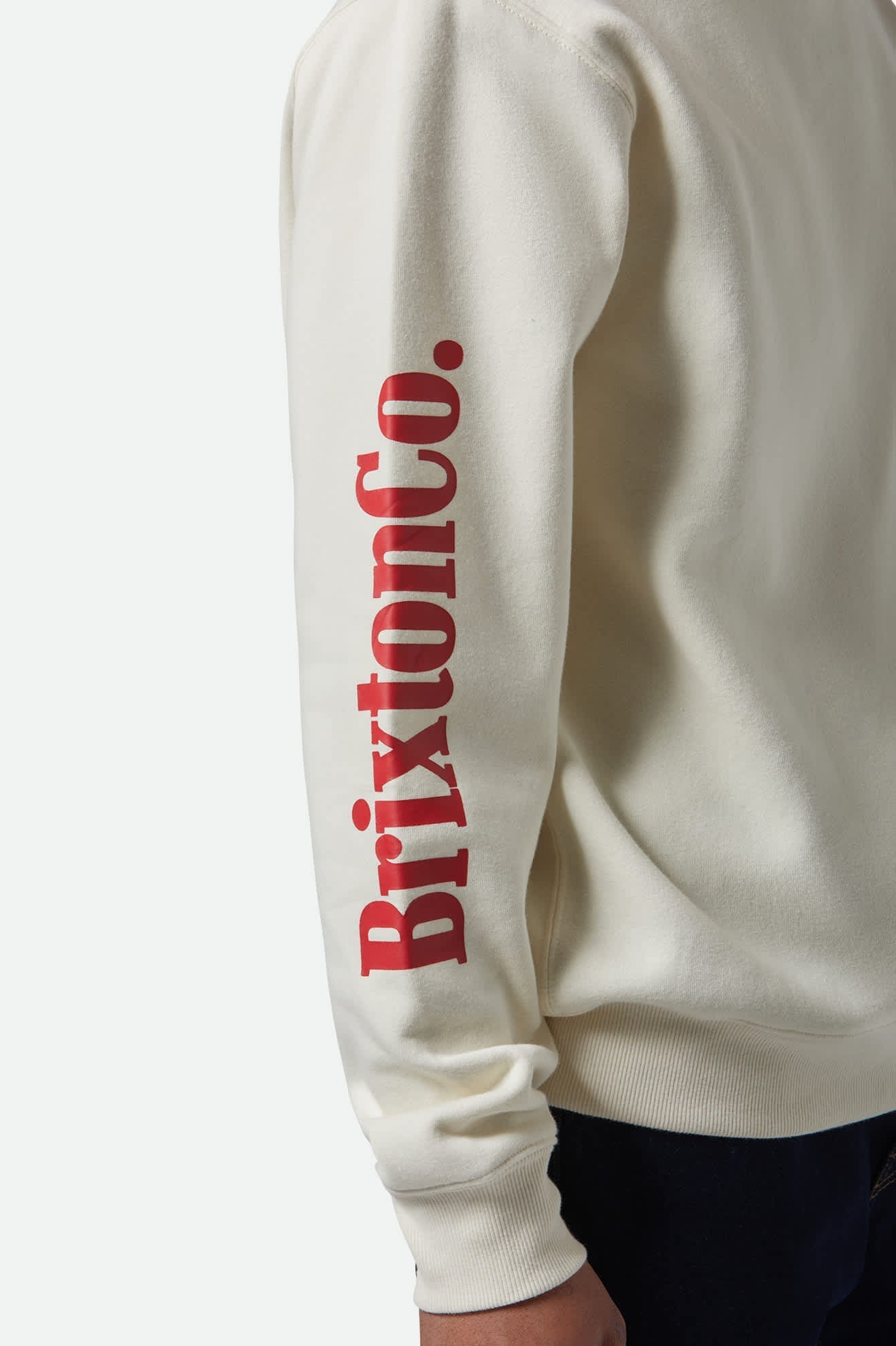 Close-up of bold sleeve print on Brixton Inwood Crew sweatshirt.