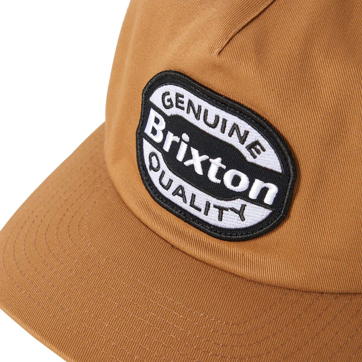 Close-up of merrowed-edge embroidered Brixton patch on Classic Trucker Hat.