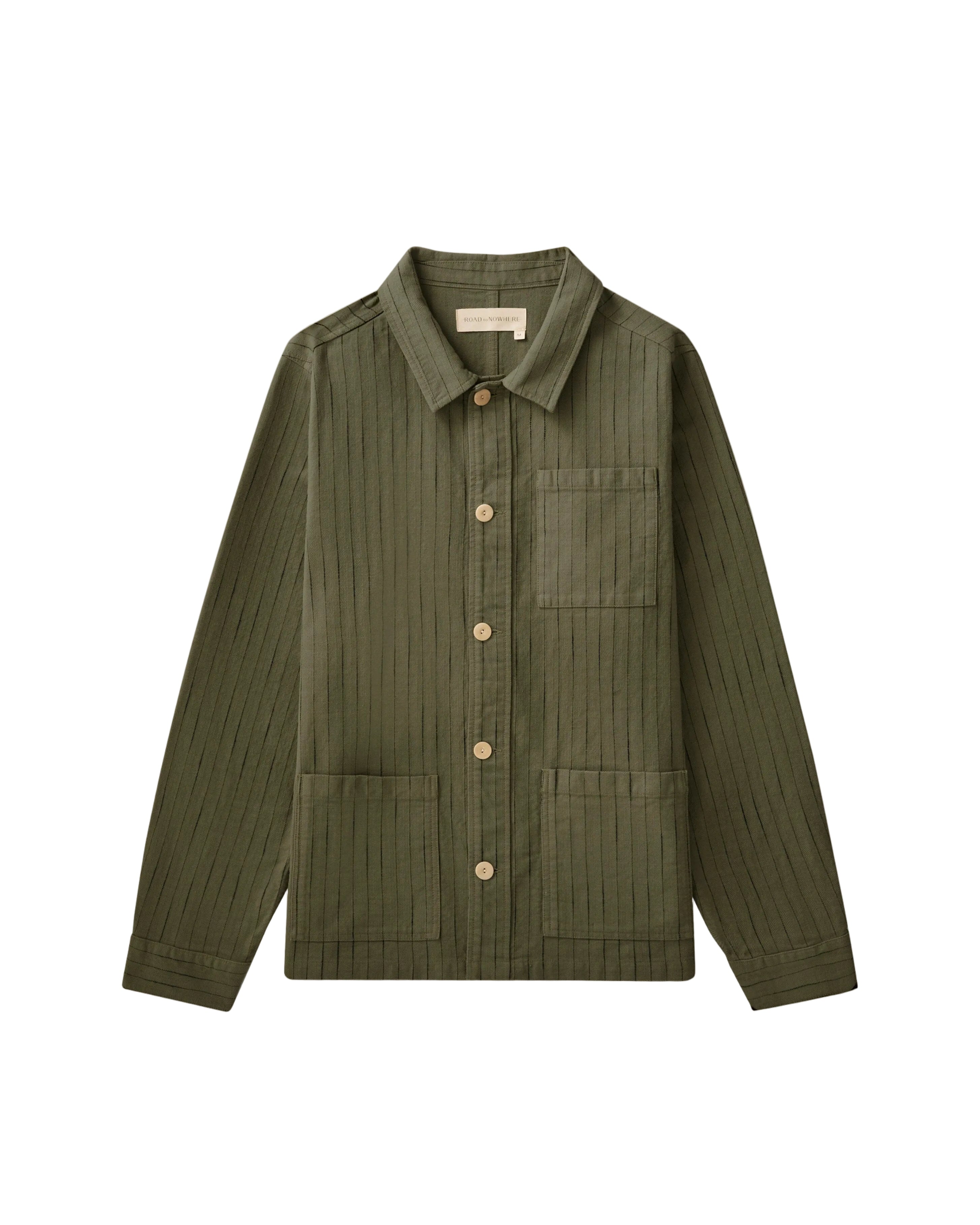 Green jacket with button details on a beige background