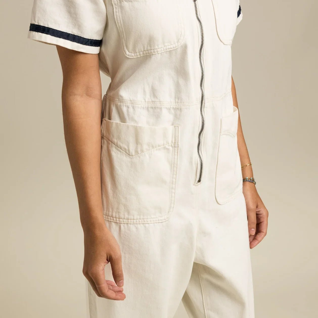 Women’s Western-meets-mechanic style jumpsuit with elastic back waist, zip closure, and functional cotton design.