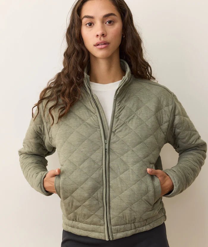 Model wearing the green Corbet Quilted Jacket from Marine Layer - Paranoid Ranch