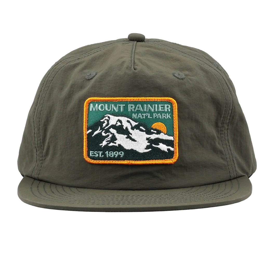 Green cap with Mount Rainier National Park patch on a white background