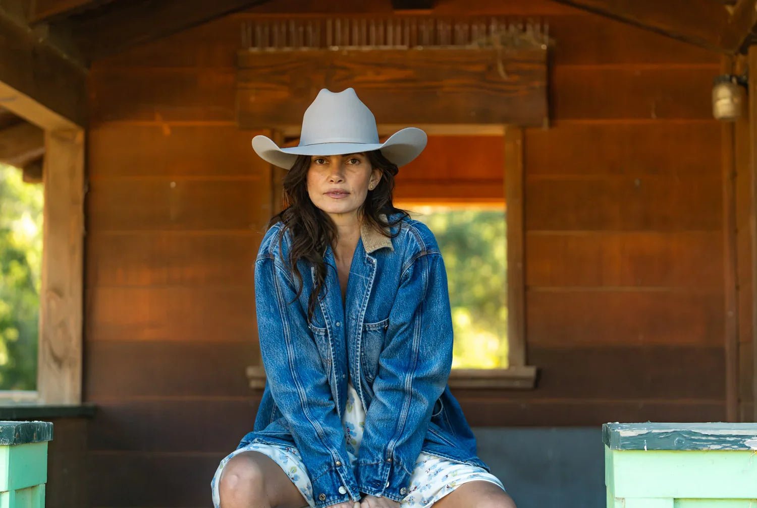 Woman in denim ranch jacket wearing a Cowboy Hat at Paranoid Ranch