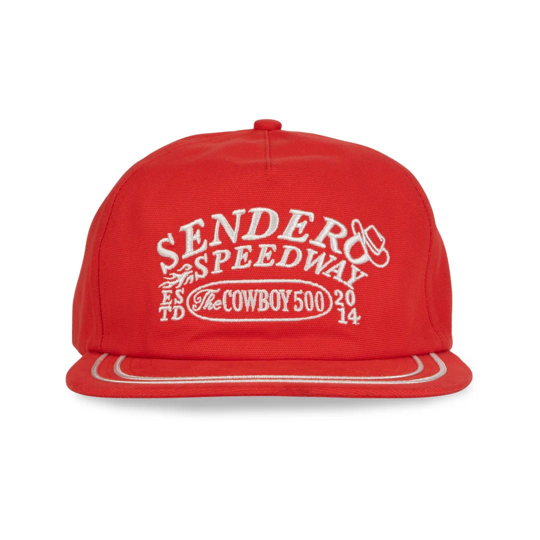 Front view of embroidered Sendero Speedway logo on front of unstructured 5-panel red snapback hat.