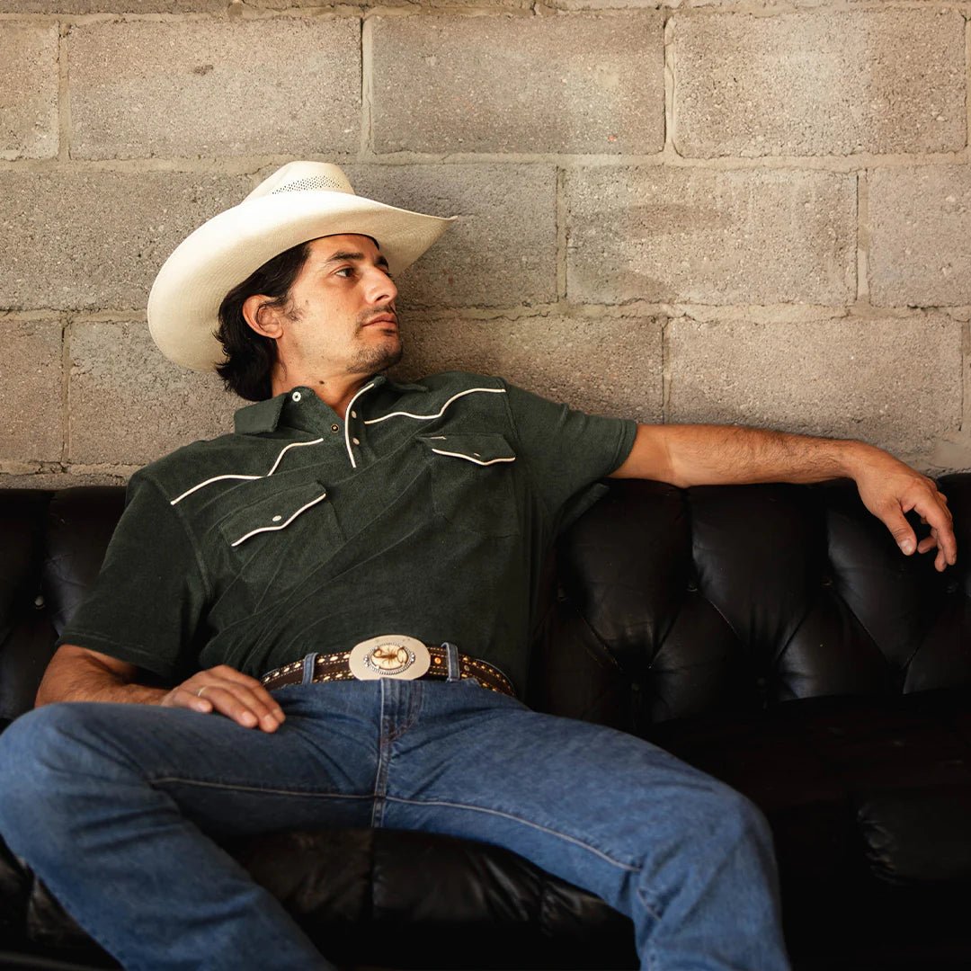 Vintage-inspired western polo in spruce green with functional pockets, western yokes, and durable cotton terry fabric.