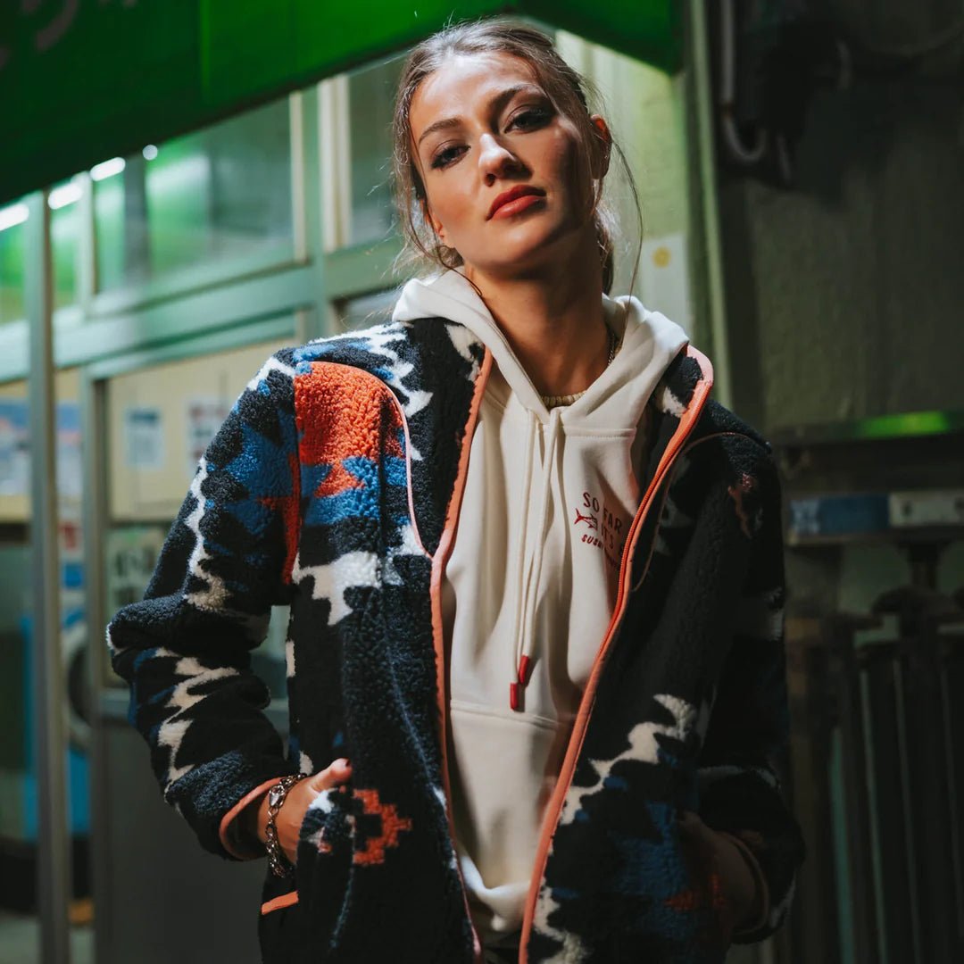 Women’s recycled polyester fleece jacket featuring vibrant southwest design and zip closure.